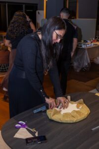 Lady participant covering table top at Design for a Difference Event 2025