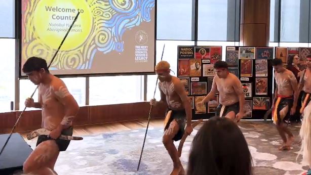 Four Indigenous performers dancing at NAIDOC Week 2025 event
