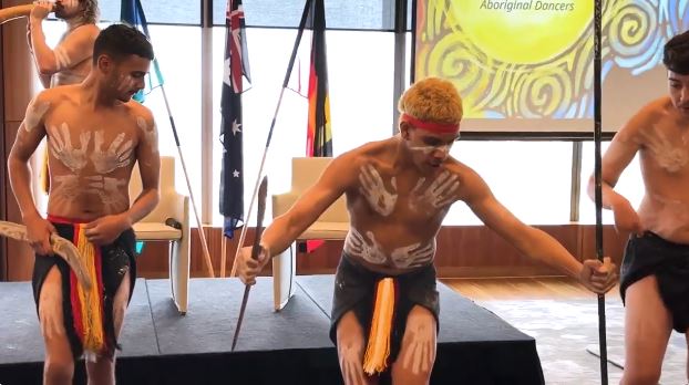 Three Indigenous performers dancing at NAIDOC Week 2025 event