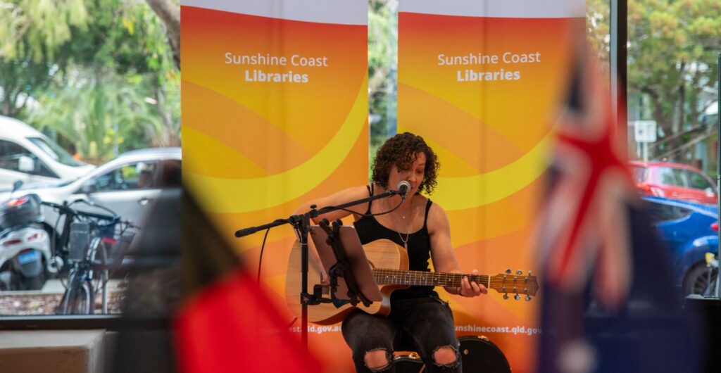 Caloundra Library Opening Event Lady playing guitar at Caloundra Library Opening Event